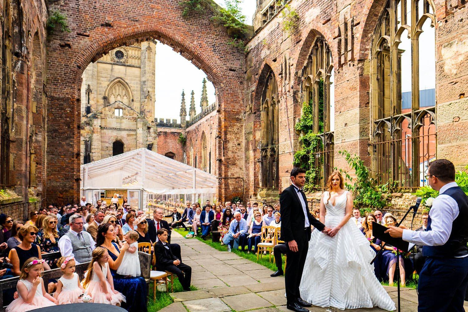 Bride and groom during ceremony at St Luke's Bombed Out Church wedding