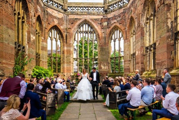 Bride and groom walk down the aisle at St Luke's Bombed Out Church in Liverpool