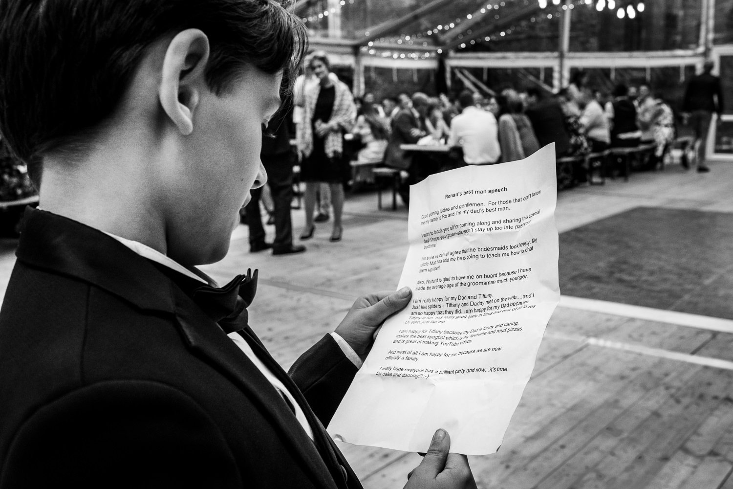 Page boy reads his speech at St Luke's Bombed Out Church wedding photography