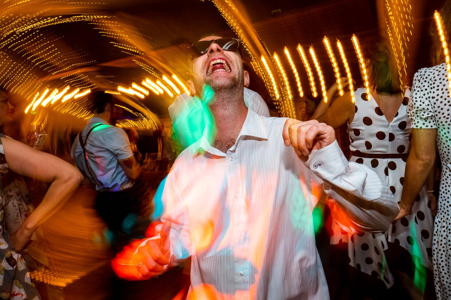 Guest dancing at St Luke's Bombed Out Church wedding