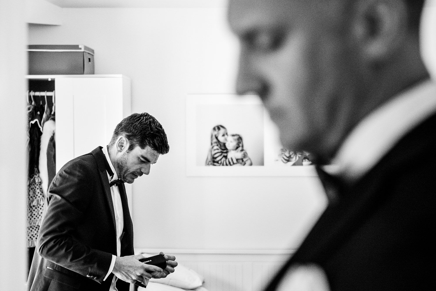 Groom and best man getting ready for St Luke's Bombed Out Church wedding