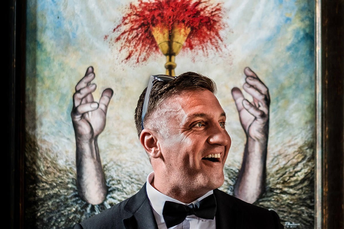 A guest laughs before the wedding ceremony at St Luke's Bombed Out Church in Liverpool