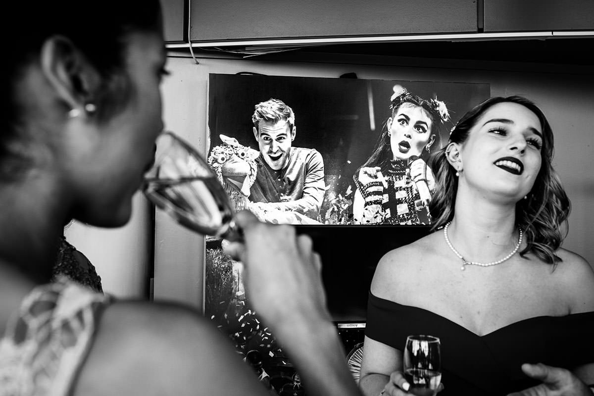 Guests drink and chat at a Lowry Theatre wedding