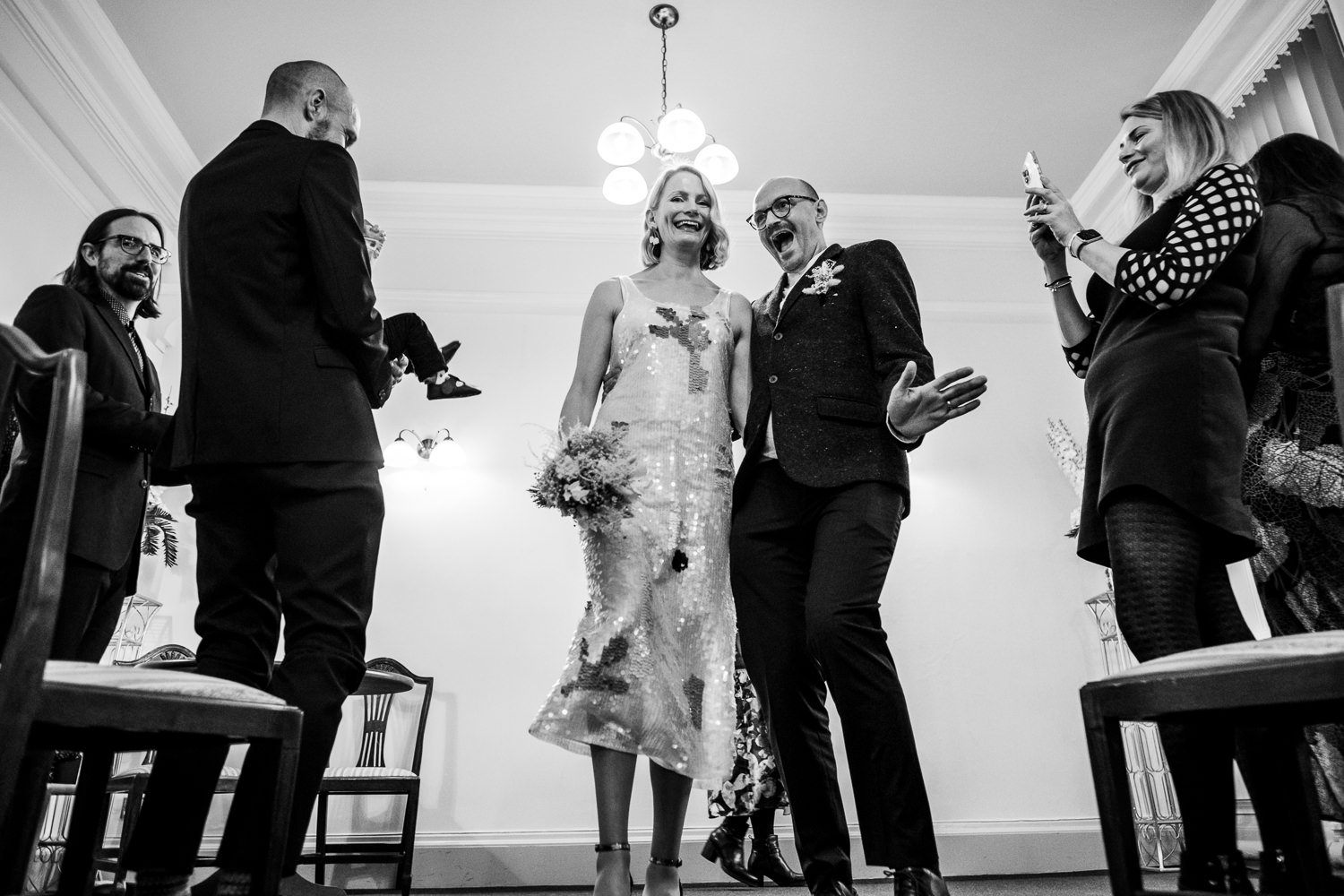 The new husband and wife celebrate their Stockport Town Hall wedding