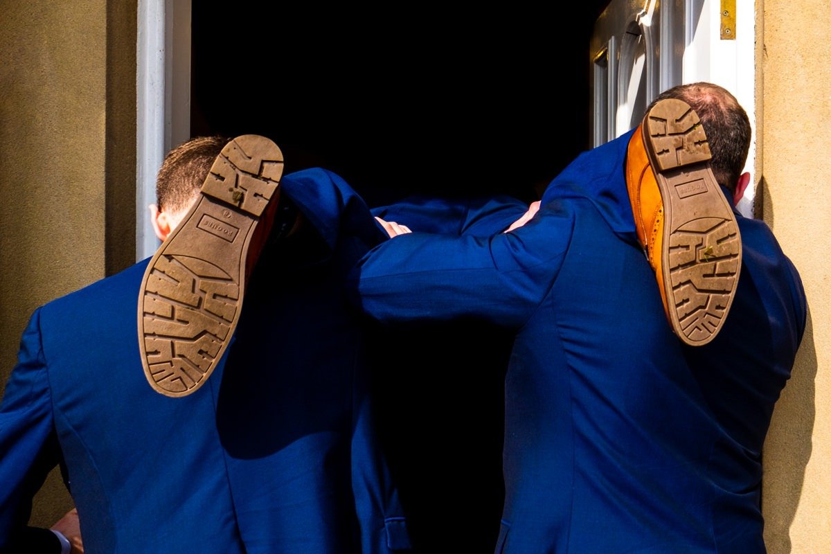 The best man's feet as he is carried into the wedding breakfast at Singleton Lodge