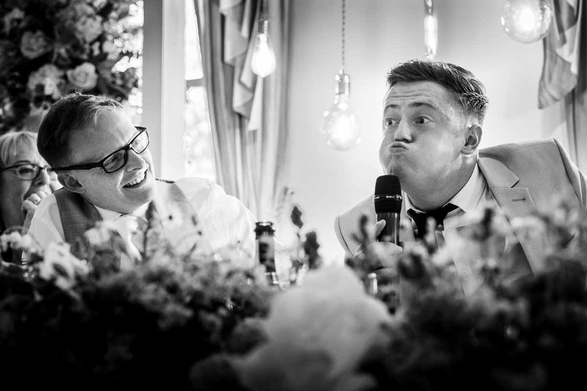 A magician performs a trick during the wedding breakfast at Singleton Lodge