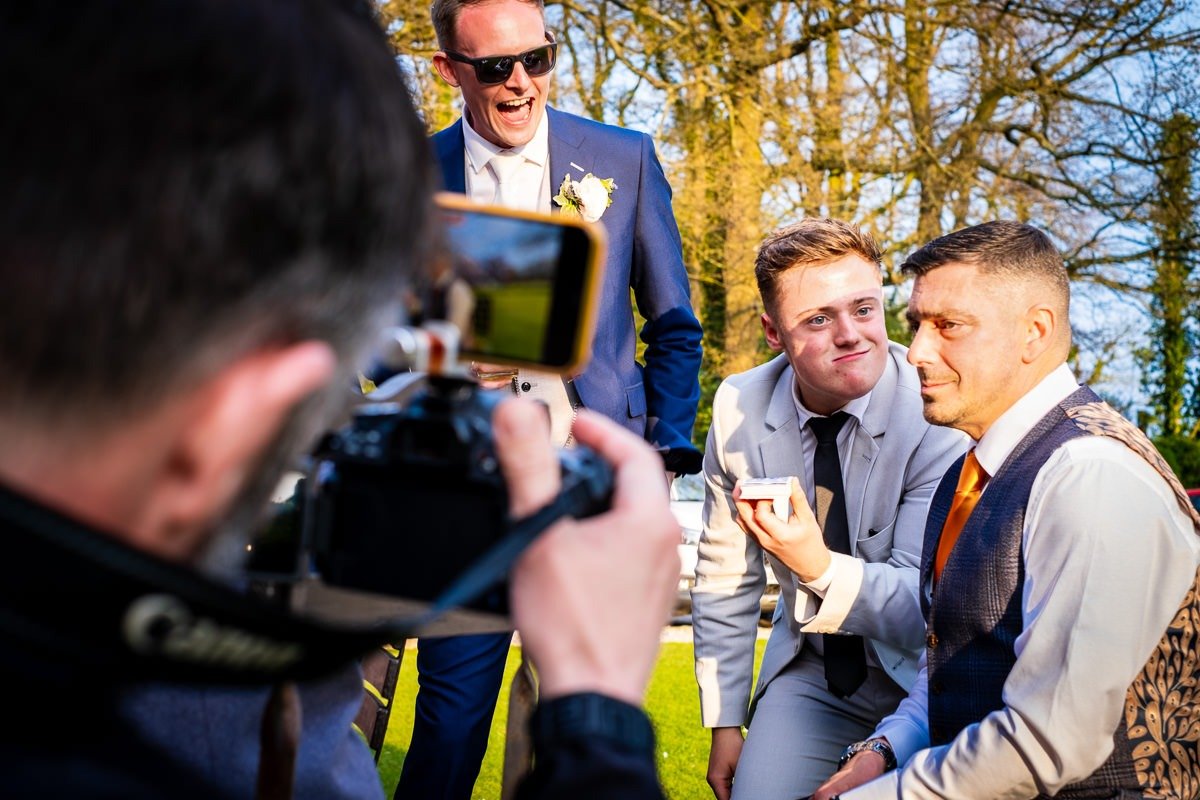 Guests react to a magician performing tricks at a Singleton Lodge wedding