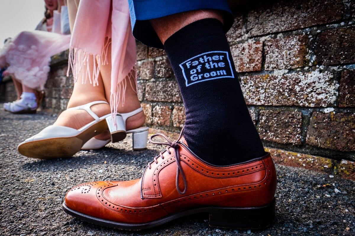 Father of the groom's socks at a Rossall School wedding ceremony