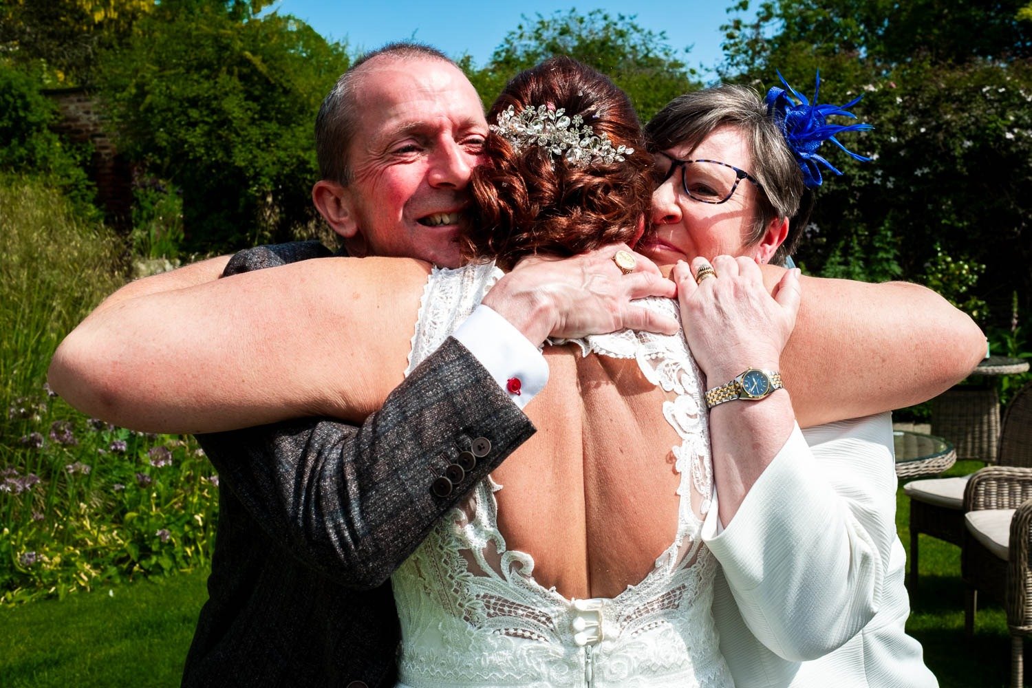 Bride hugs two guests at Grays Court wedding