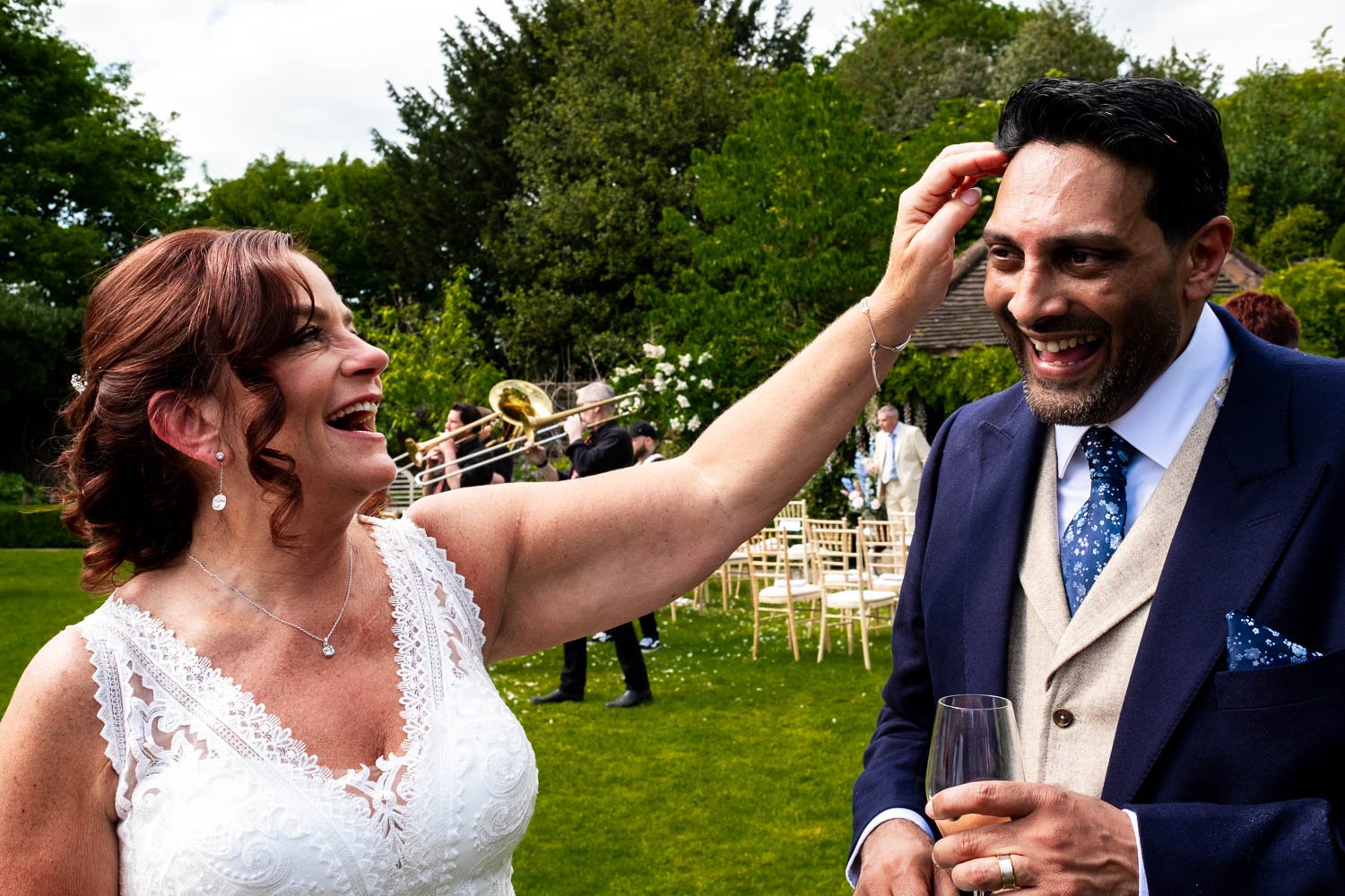 Bride removes confetti from groom's hair at Grays Court in York