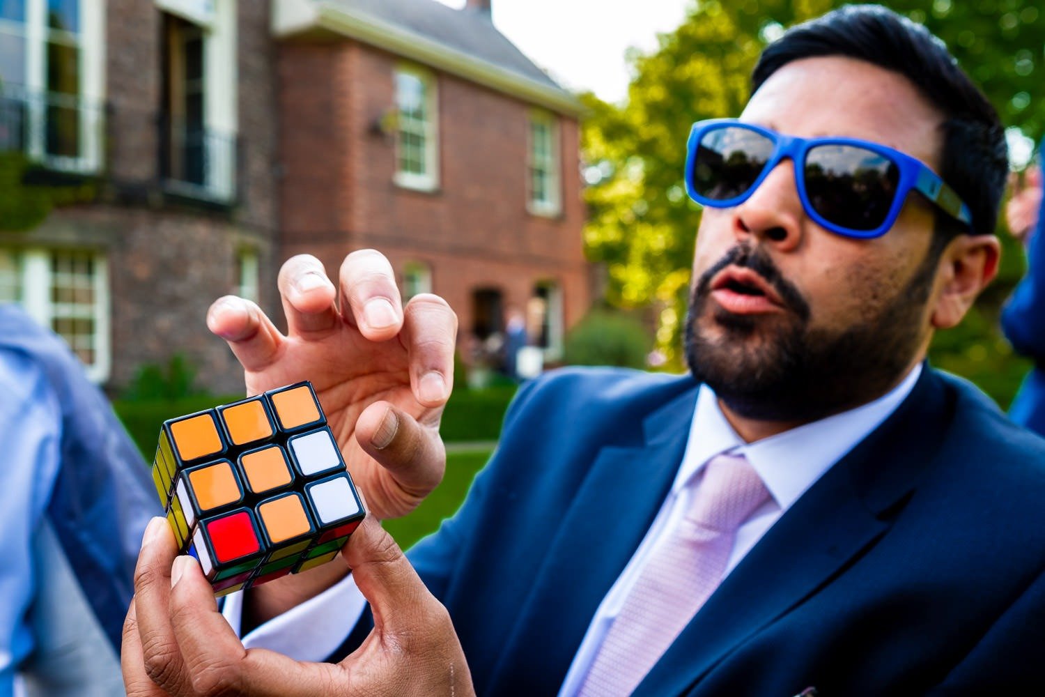 Wedding guest with Rubik's cube at Grays Court