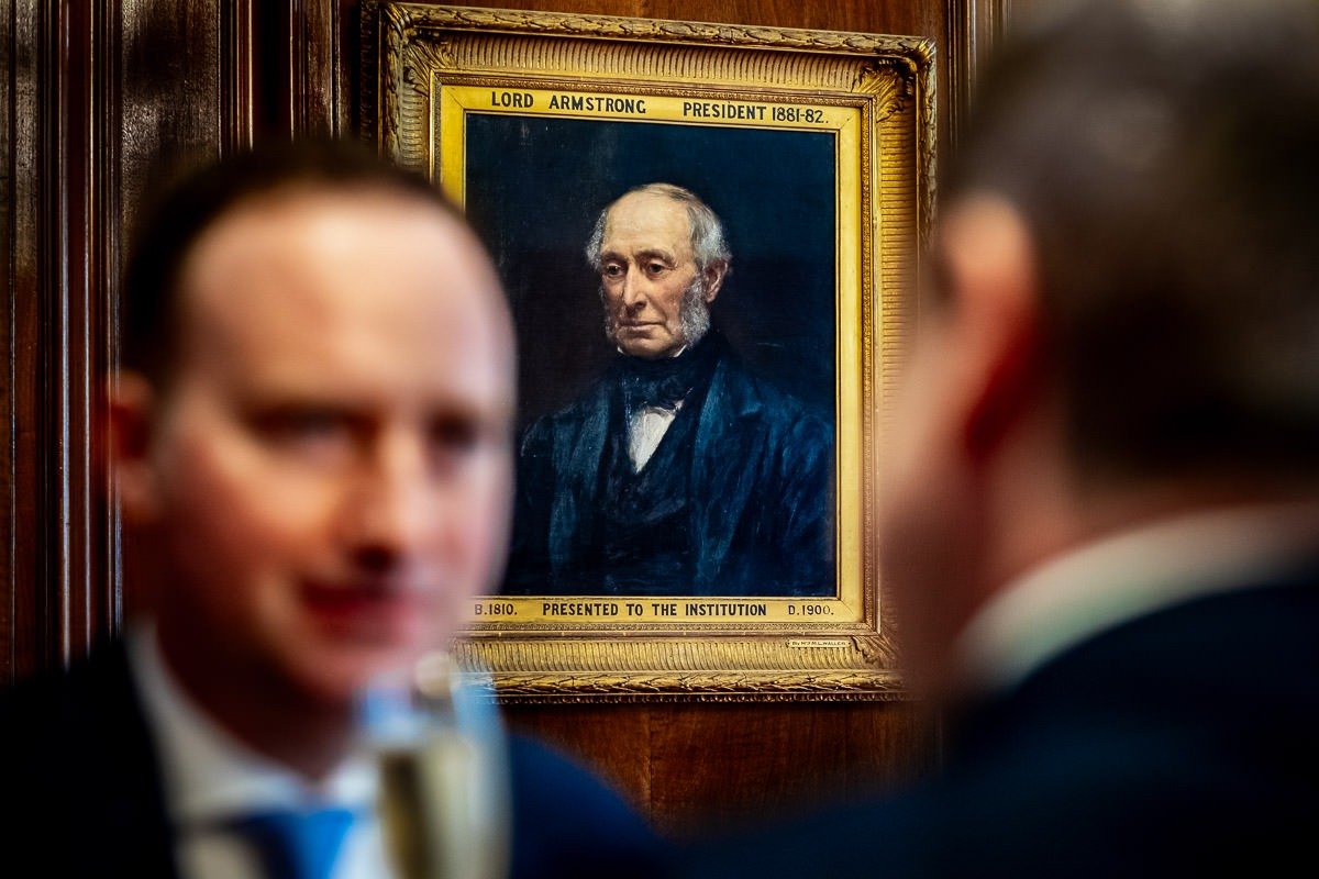 Grooms overlooked by painting at One Great George Street