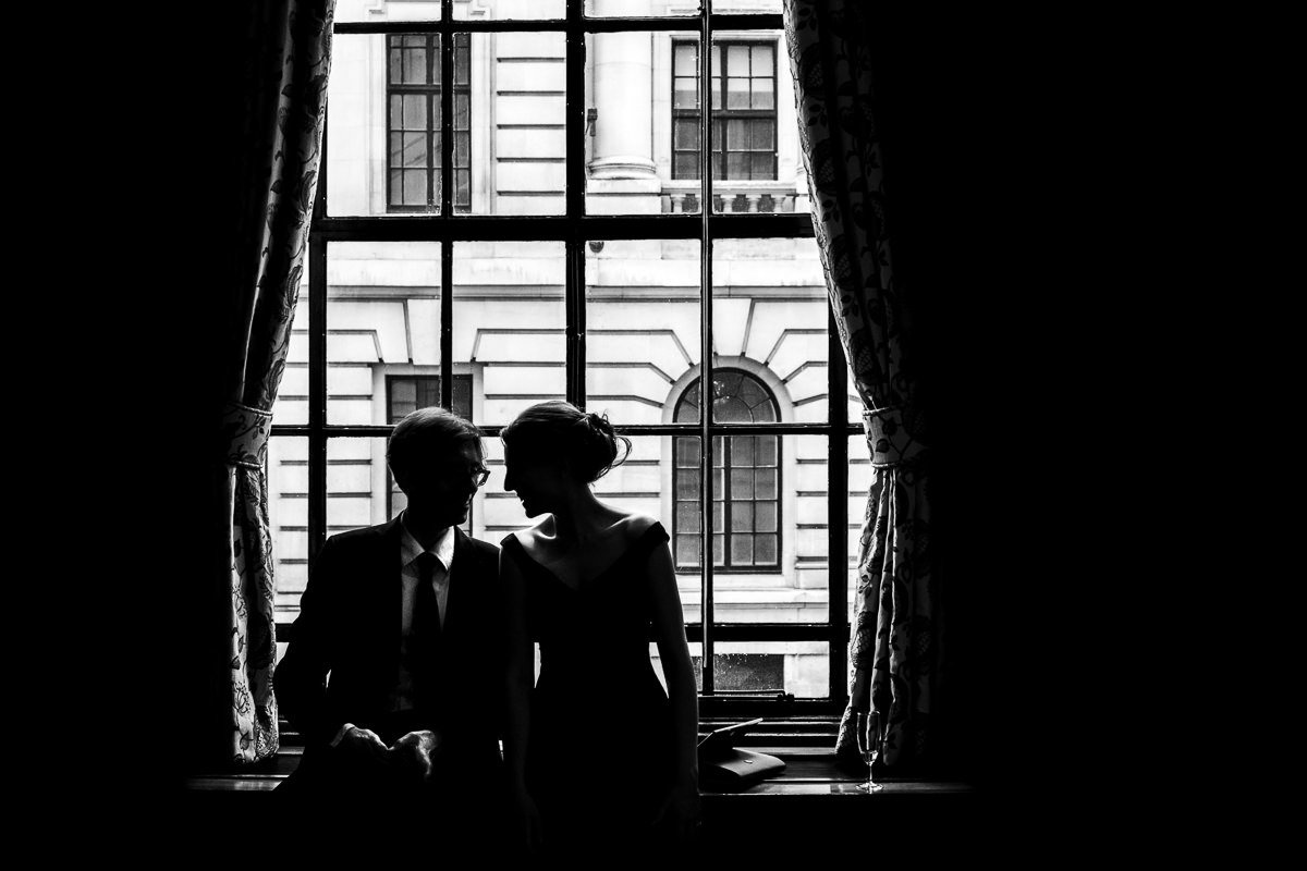 Guests silhouetted in window at One Great George Street