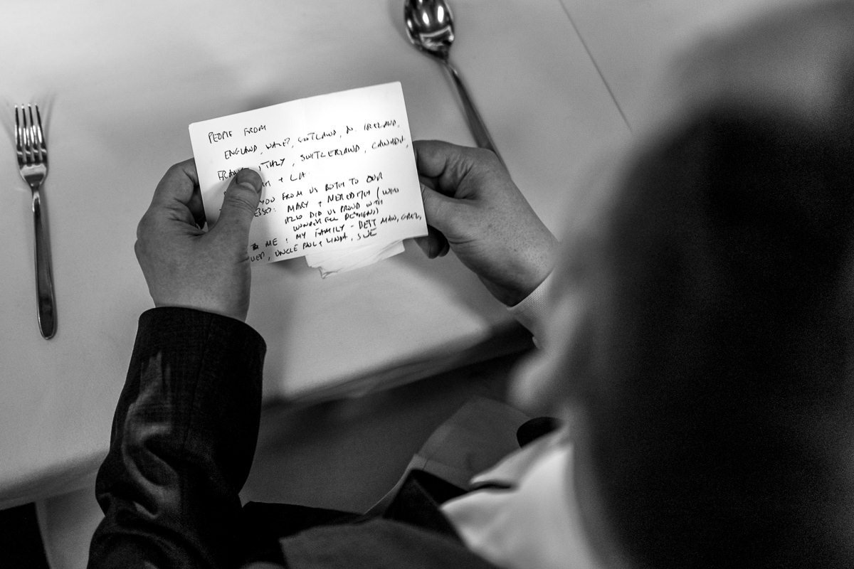 Groom looks at speech cards during One Great George Street wedding