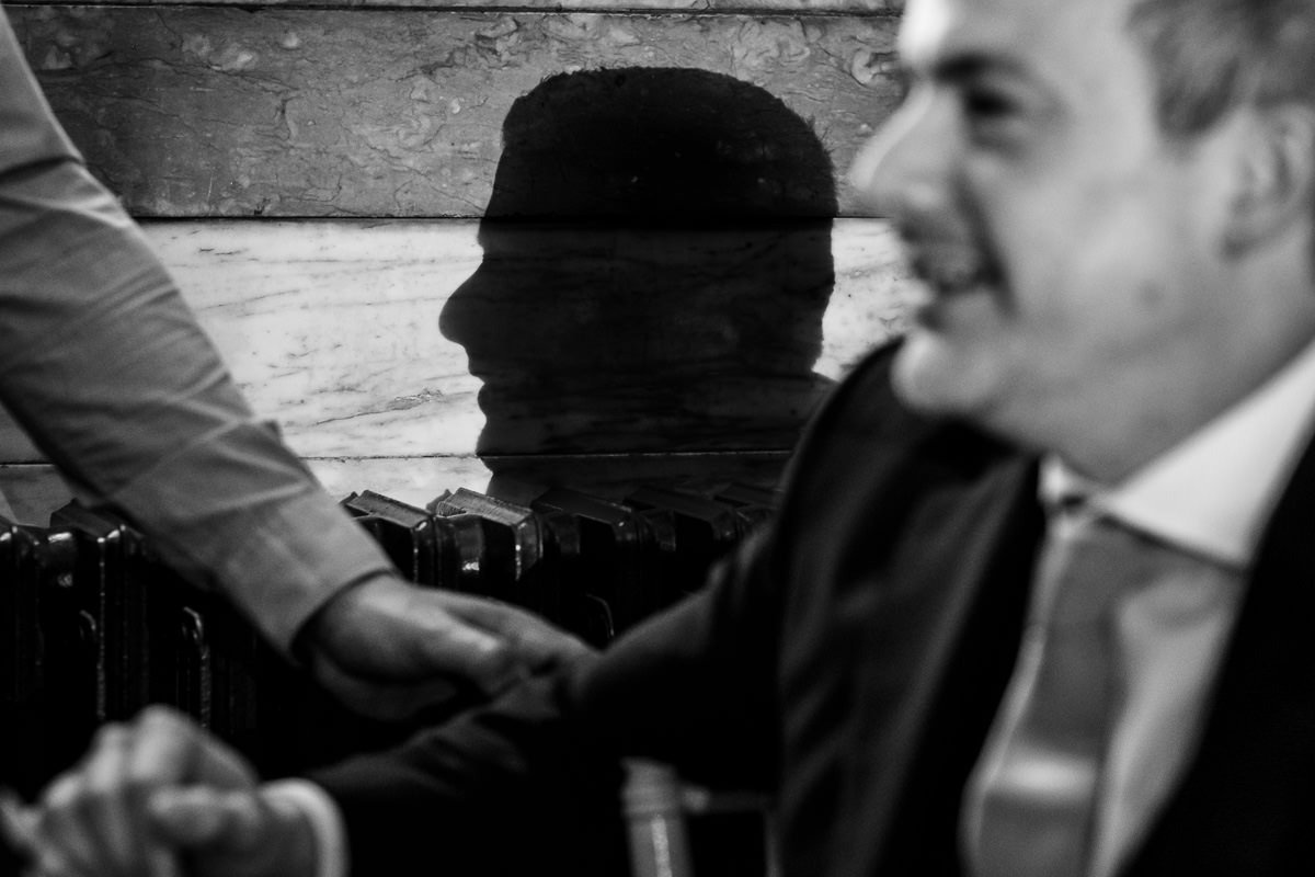 Shadow of groom on wall at One Great George Street wedding