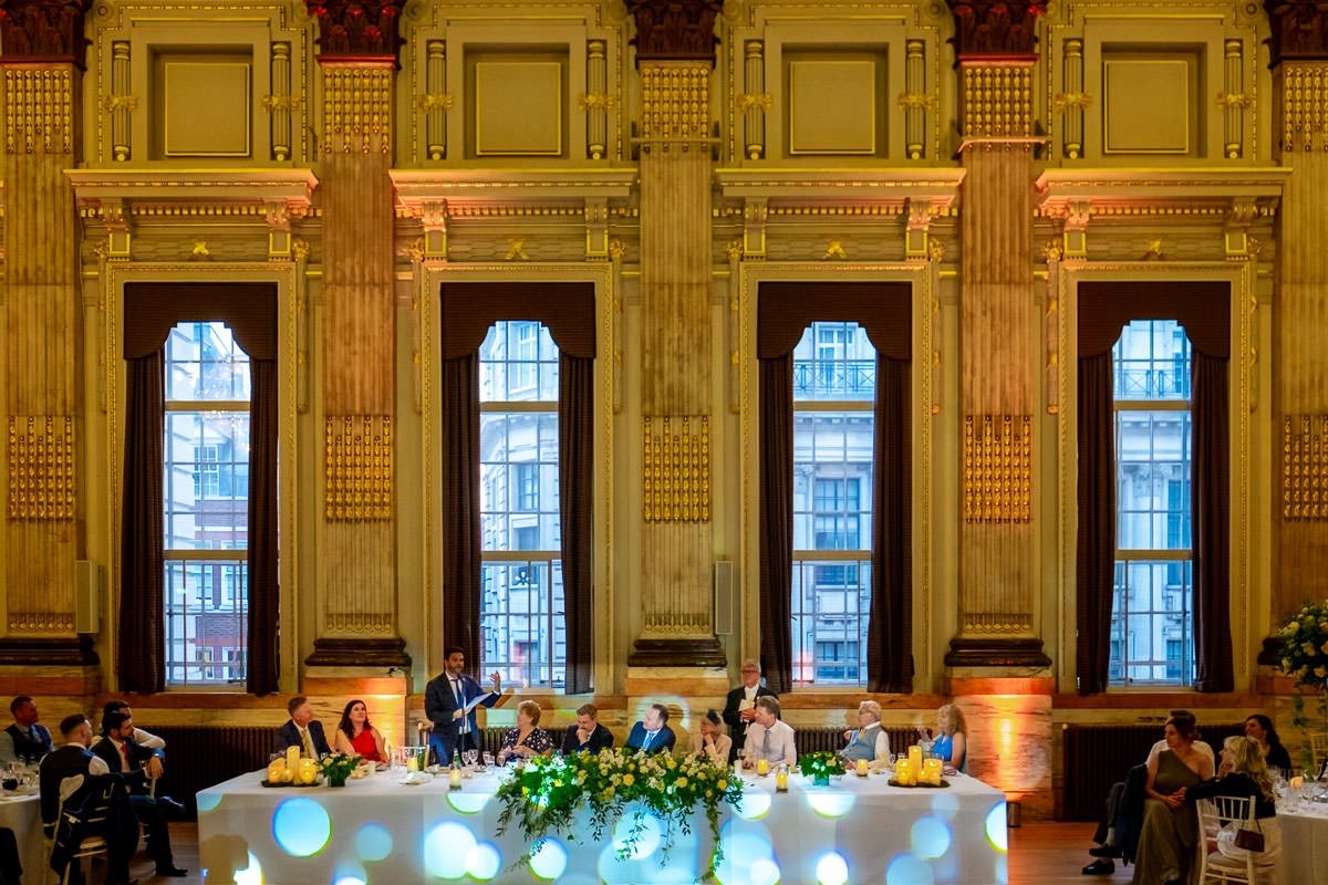 Wide view of Great Hall at One Great George Street during best man's speech