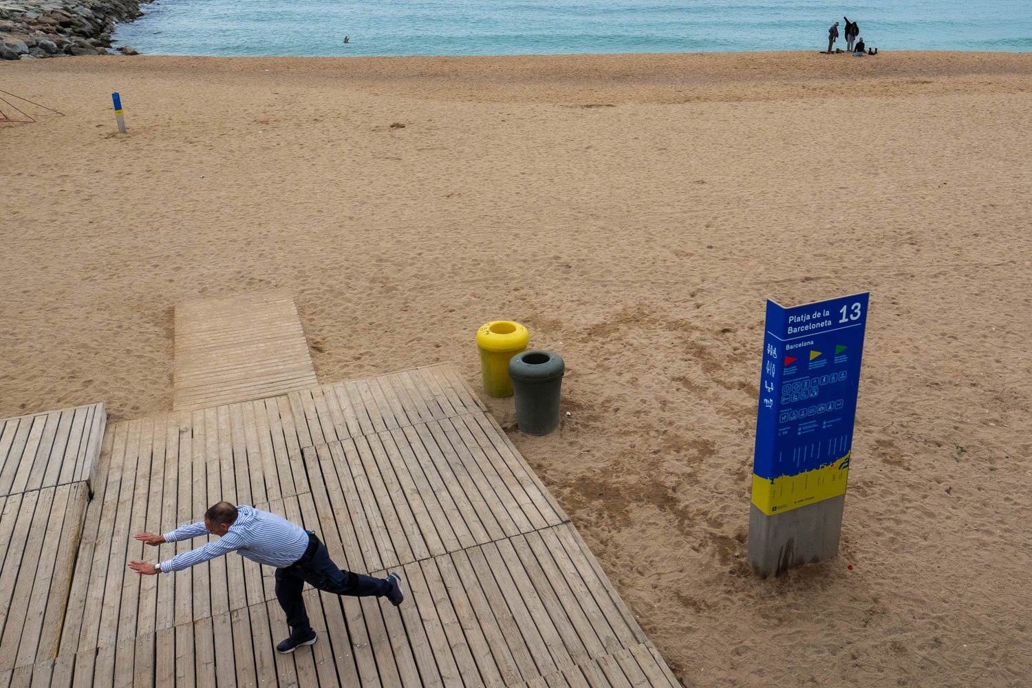 Man pushing thin air on Barceloneta beach