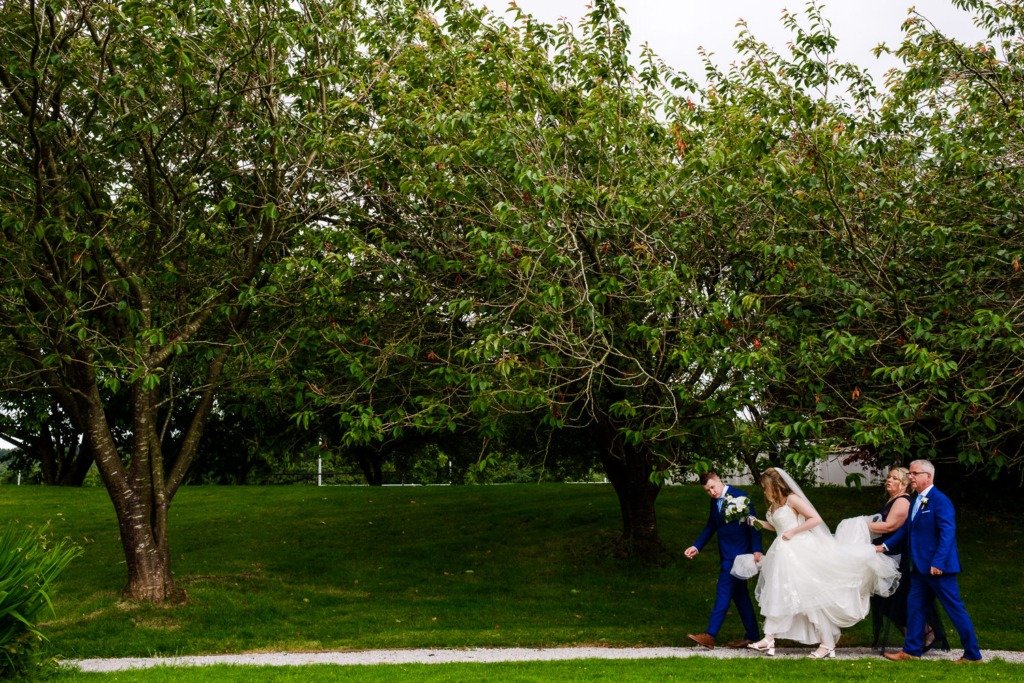 Bride and groom walk at Mytton Fold after their Ribble Valley wedding